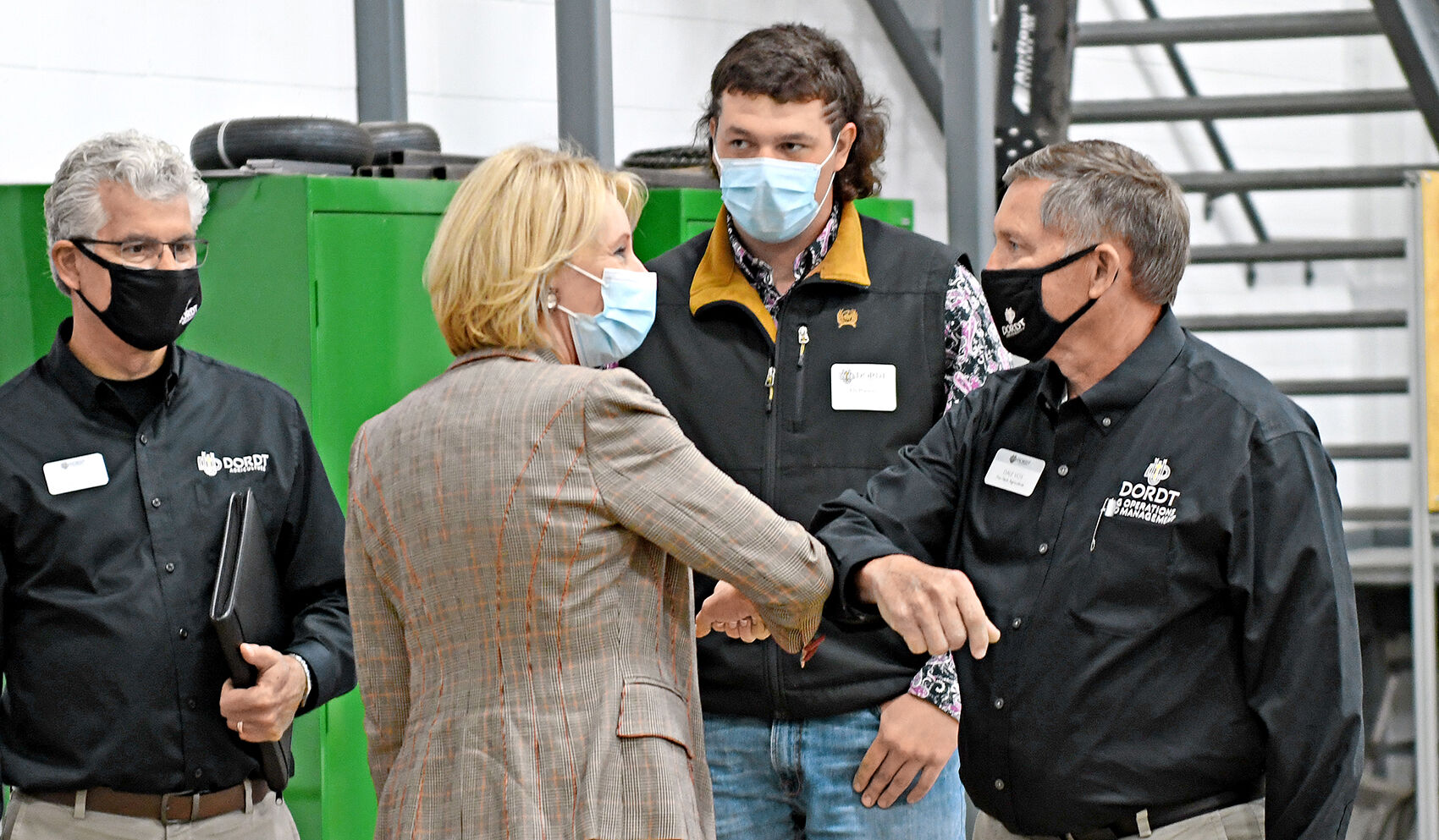 DeVos elbow-bumps at Dordt University